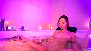 Skinny brunette in tight jeans reveals her tiny titties and wet slit