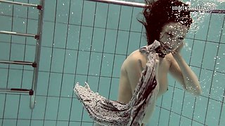 Cute European teenie caught on cam in the pool underwater