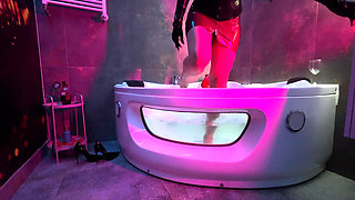 Mistress' Taking a Bath in Latex and Boots