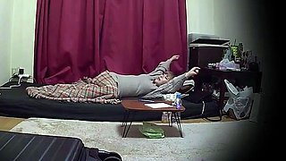 Cute amateur asian web cam girl playing with her toy