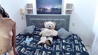 Horny Latina masturbates showing her tits.