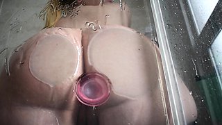 Horny hot blonde masturbates in the shower with a toy