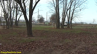 Redhead wife pissing in outdoor