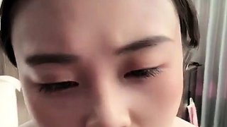 Horny Japanese teen in school uniform sucks cock