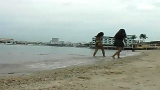 2 sexy Latina's presenting latex fetish in the pool and on the beach