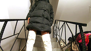 Black Downjacket Fetish on the Stairs. Bodystocking, Shiny Boots and Intimate Tease