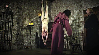 Mooin Witch the Exhausted Milkmaid Is Pulled Upside Down to the Ceiling with Weights at Her Wrists to Be Tormented and Interroga