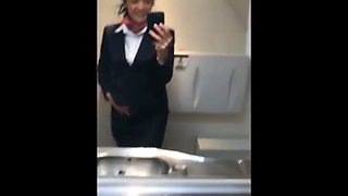 Naughty stewardess with hot tits masturbates in toilet