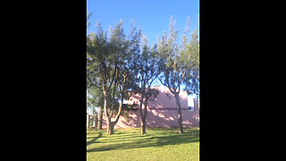 Stepmother in a Bikini in the Garden of the House Makes a Video for Her Stepson, to Show off Her New Clothes.