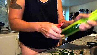 Hot French MILF Kahann masturbates with cucumber in kitchen close-up amateur video
