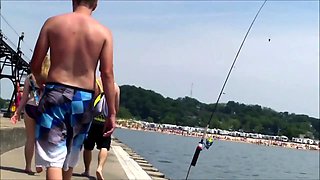 Beach voyeur chases a delightful babe with a marvelous ass