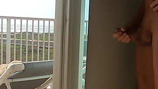Sunning on the balcony in plain view of everyone walking by