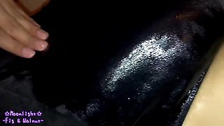 Dark blue bathing suit with greasy lotion!