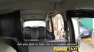 Kaz B in black lace camisole and plaid skirt sits in Fake Taxi backseat