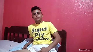 Elian is in his bedroom, where he strips down to his underwear and pulls his hard cock out of the pants of his boxers. After stroking it for a bit, the young Latino completely undresses, leans back on the bed and begins to masturbate decisively.