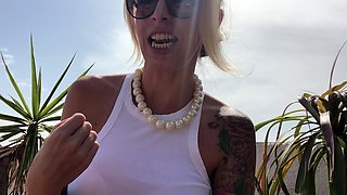 Blonde is flashing her big boobs in the outdoors