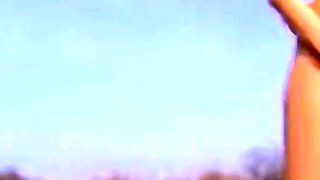 Two Babes With Big Natural Tits Share a Dildo at the Beach