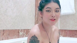 Busty babe playing with her big boobs