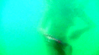 My tits underwater on public beach