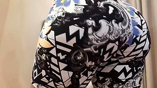 Twerking in gym shorts and bouncing his rump on the chair
