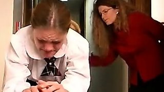 An amateur redhead lesbian is eating pussy from a brunette