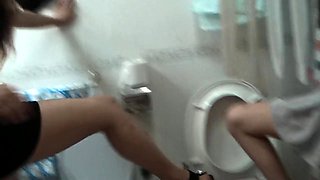 Dominant Japanese lady punishing her slave in the toilet